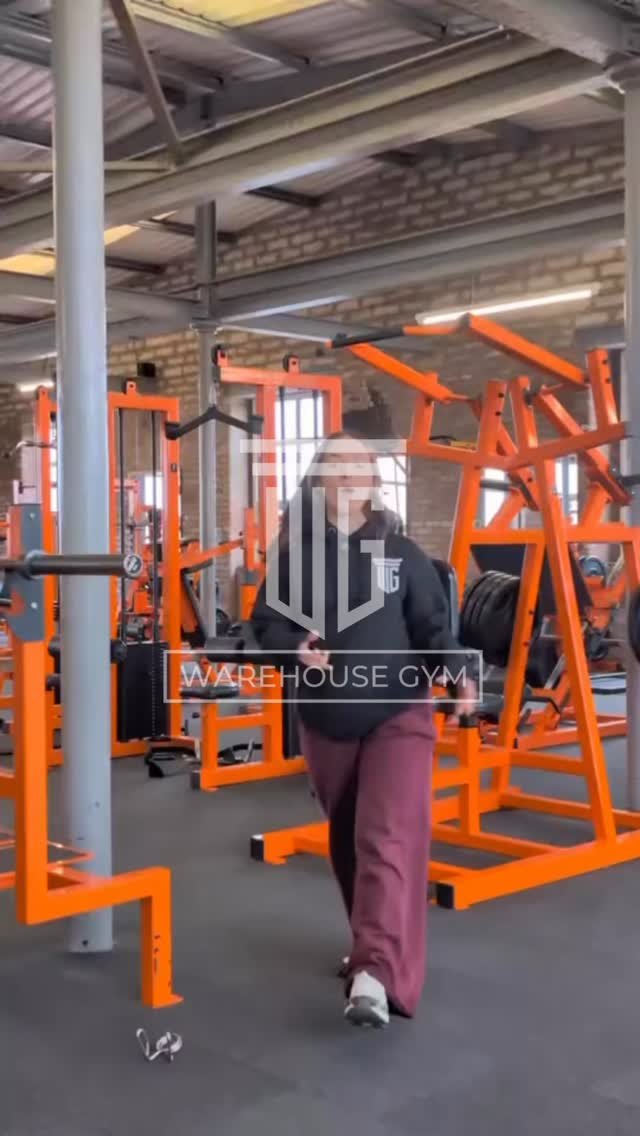 Rows of bright orange custom WG machine frames across the mill floor